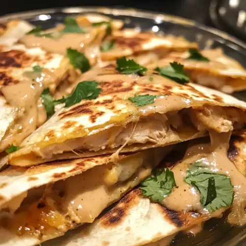 Cheesy Hot Honey Chicken Quesadillas with Spicy Jalapeño Cream Sauce